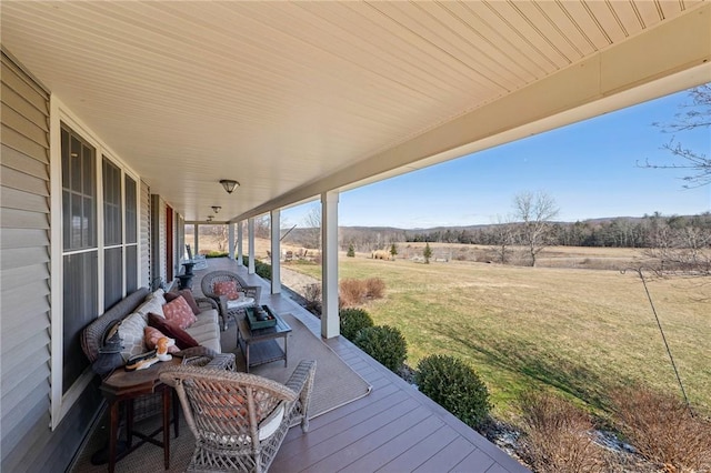 wooden deck with a lawn