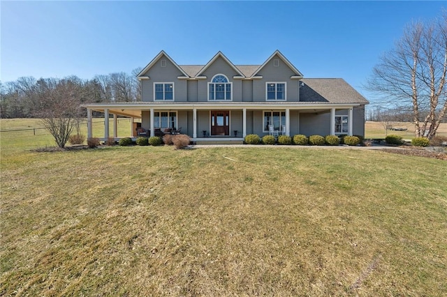 view of front of property featuring a front yard and covered porch