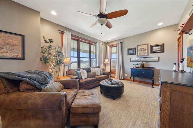 living room featuring recessed lighting, light colored carpet, ceiling fan, and baseboards