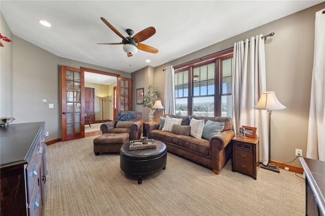 living area featuring baseboards, a ceiling fan, light colored carpet, french doors, and recessed lighting