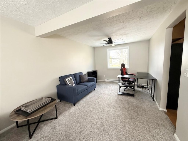 living room featuring a textured ceiling, carpet, a ceiling fan, and baseboards