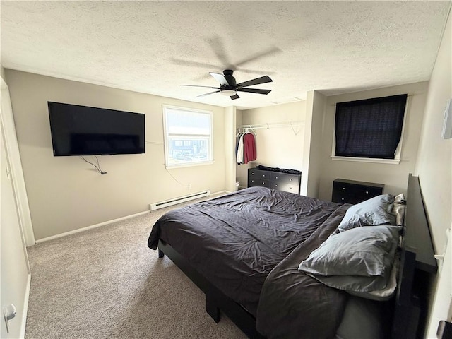 carpeted bedroom featuring a textured ceiling, ceiling fan, a baseboard radiator, baseboards, and a closet