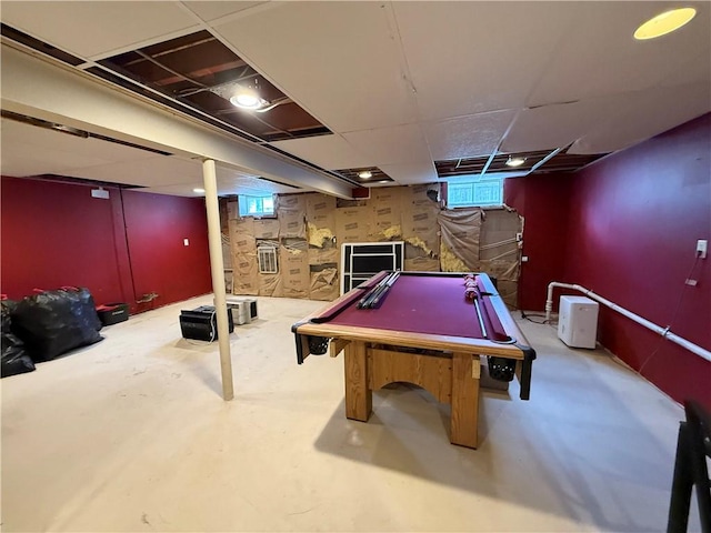 playroom with concrete flooring, billiards, and a paneled ceiling