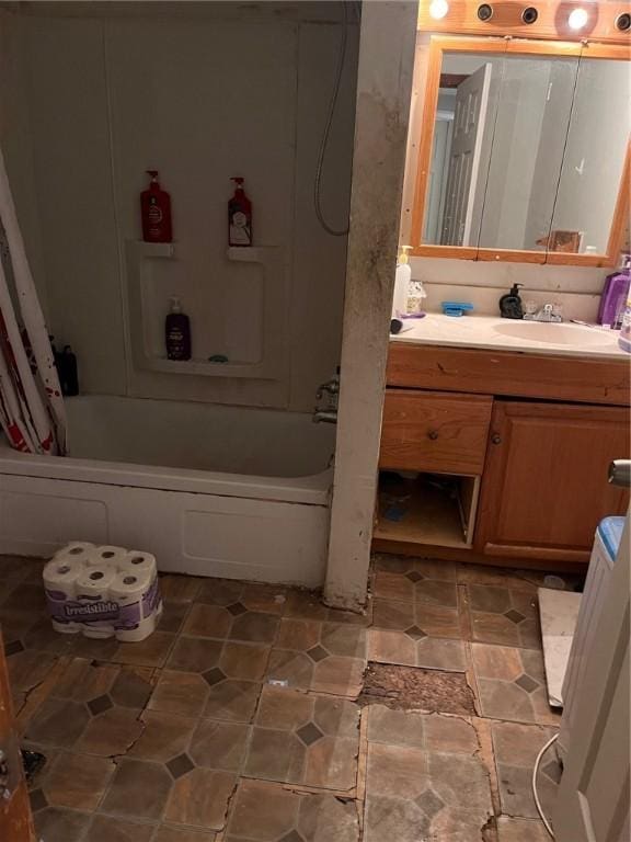 bathroom featuring shower / washtub combination and vanity