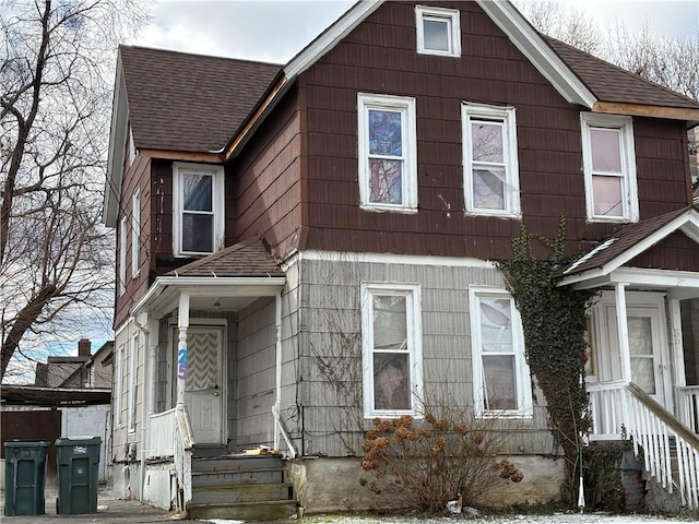 view of front of home featuring entry steps and a shingled roof