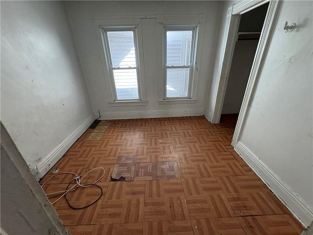 interior space featuring baseboards