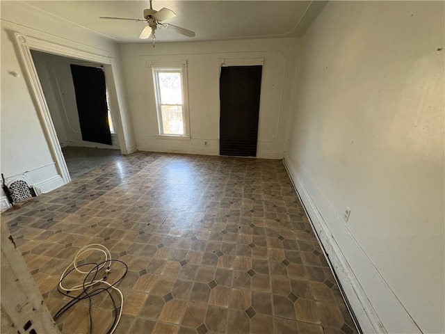 unfurnished room featuring ceiling fan