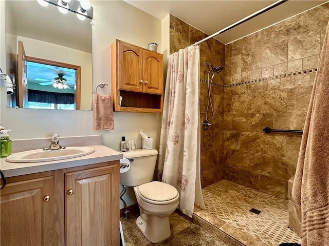 full bath with toilet, a tile shower, and vanity