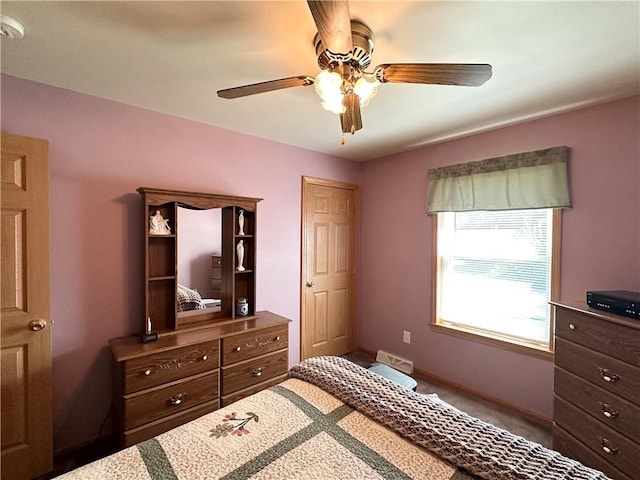 bedroom featuring ceiling fan and baseboards