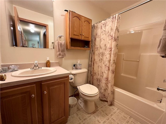 bathroom featuring toilet, shower / tub combo with curtain, and vanity