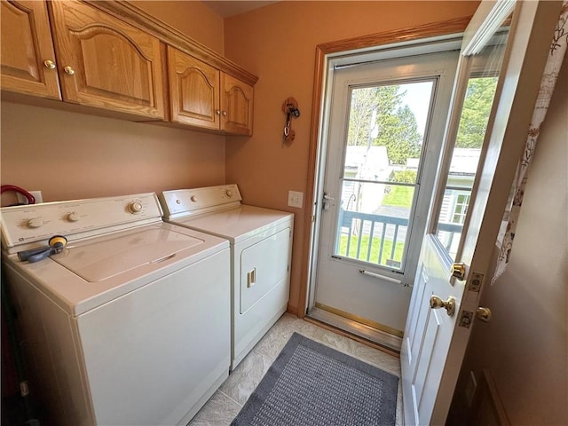 laundry room featuring cabinet space and washer and clothes dryer