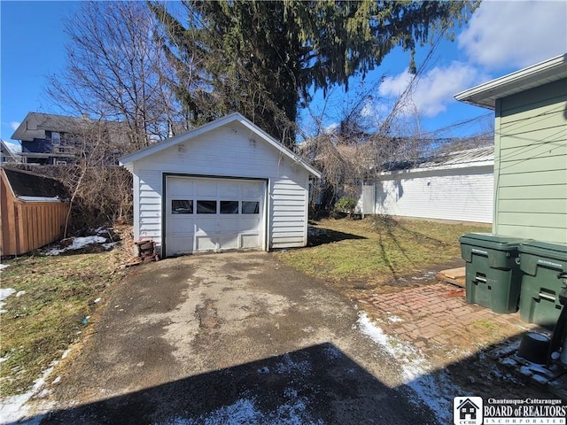 detached garage with aphalt driveway