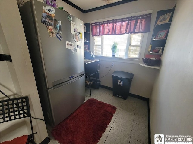 washroom with baseboards