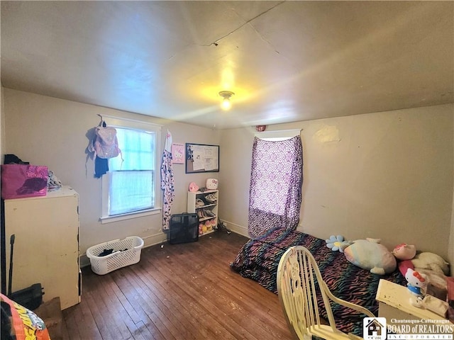 bedroom with hardwood / wood-style floors