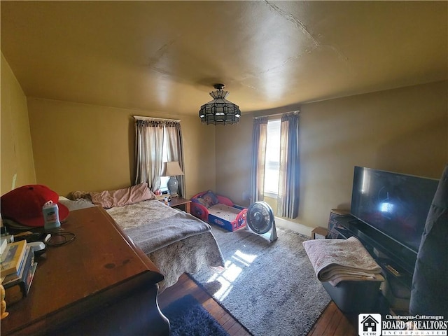 bedroom with wood finished floors