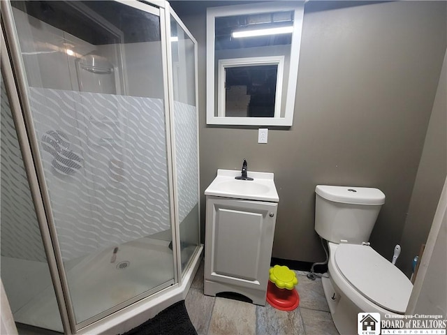 full bath with toilet, a shower stall, and vanity