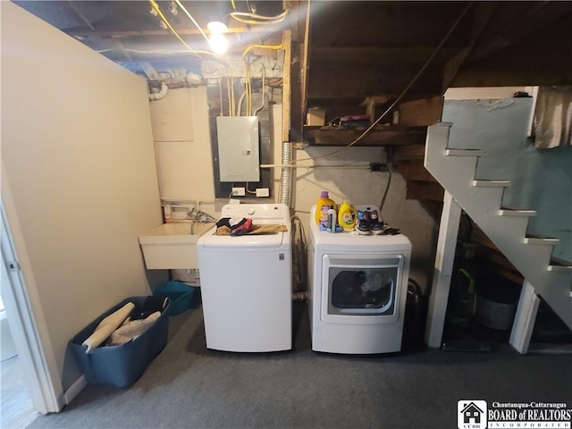 laundry room featuring laundry area, electric panel, a sink, and independent washer and dryer