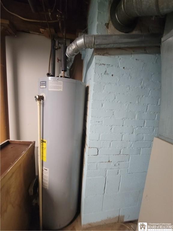 utility room featuring water heater