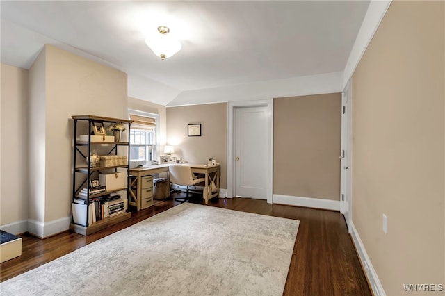 office area with vaulted ceiling, dark wood-style flooring, and baseboards