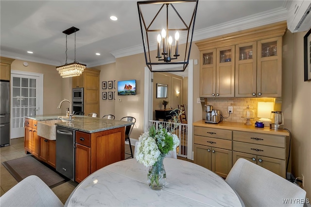 kitchen featuring crown molding, backsplash, a wall mounted AC, appliances with stainless steel finishes, and a sink