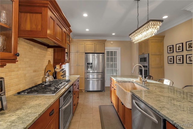 kitchen featuring appliances with stainless steel finishes, a sink, light stone counters, and light tile patterned floors