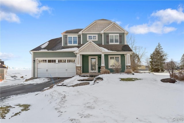 view of front of home with a garage and stone siding