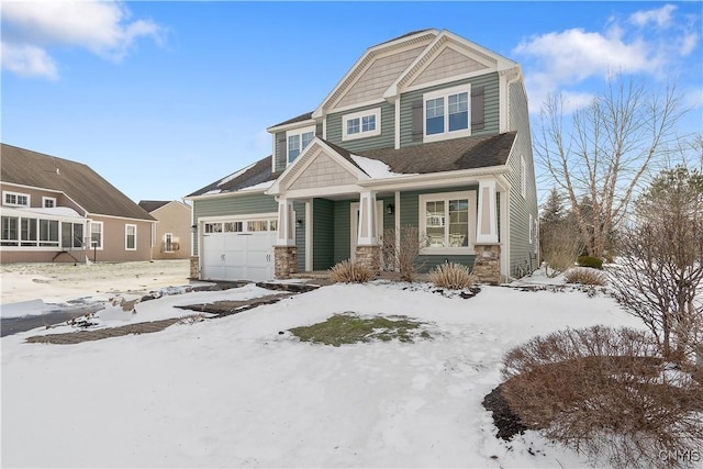 view of front of house featuring a garage and stone siding