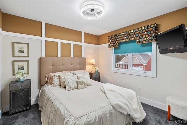 bedroom featuring carpet and baseboards