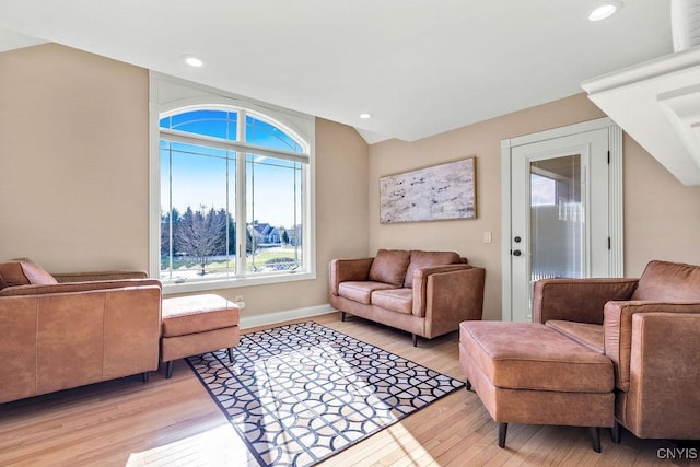 living area featuring recessed lighting, light wood-style flooring, and baseboards