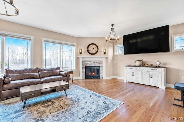 living room with a healthy amount of sunlight and light wood-style floors