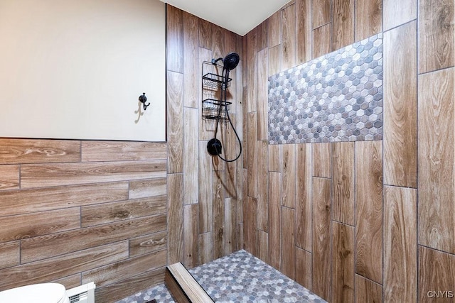 full bath with a tile shower