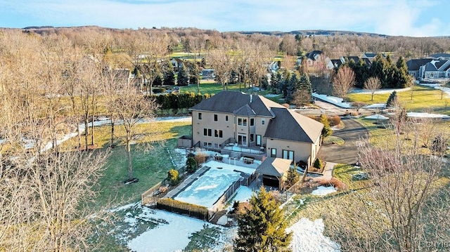 birds eye view of property with a wooded view