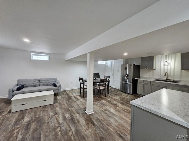 interior space featuring recessed lighting, dark wood finished floors, and baseboards