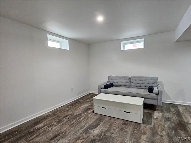 living area featuring recessed lighting, dark wood finished floors, and baseboards