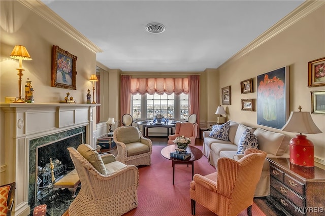 sitting room featuring a fireplace, visible vents, and ornamental molding