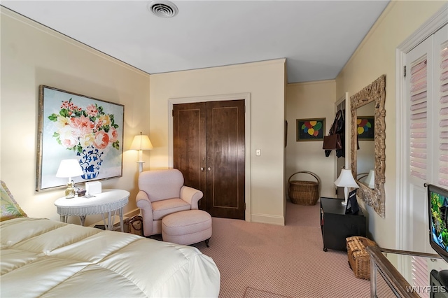 carpeted bedroom featuring baseboards, visible vents, and a closet