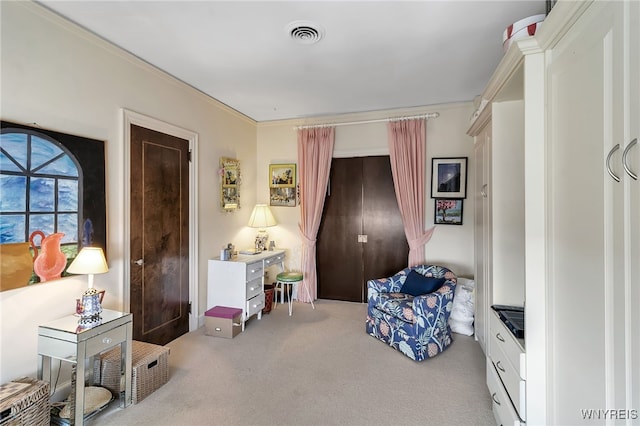 living area with carpet and visible vents