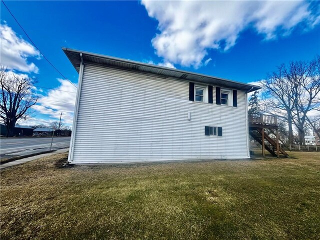 231 E Main St, Waterloo, NY 13165 - view of side of property featuring a yard and stairs