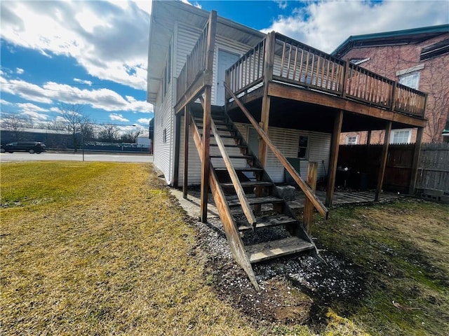 231 E Main St, Waterloo, NY 13165 - view of side of property featuring stairs, a deck, and fence