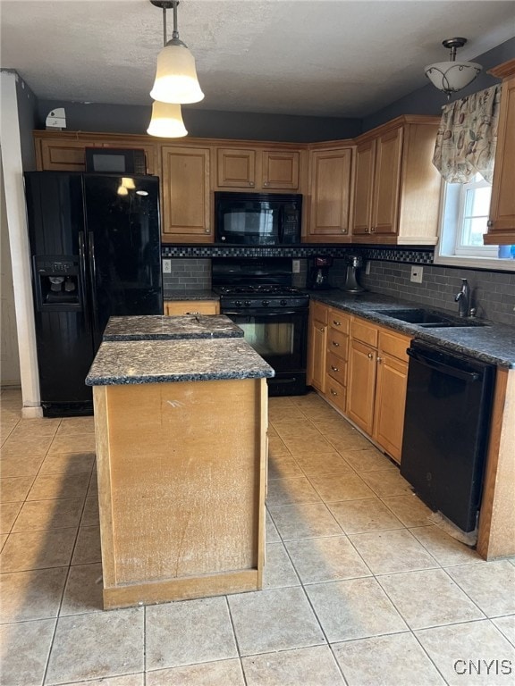 kitchen featuring decorative backsplash, a center island, black appliances, a sink, and light tile patterned flooring