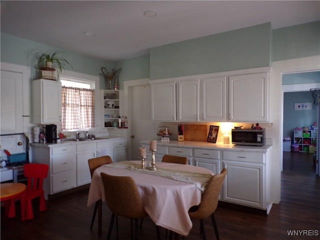 dining area with dark wood finished floors