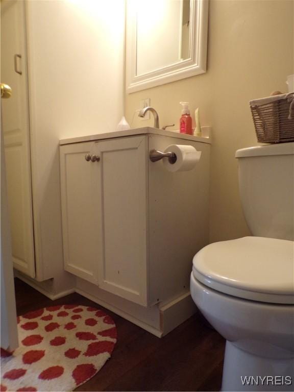 bathroom featuring toilet and wood finished floors