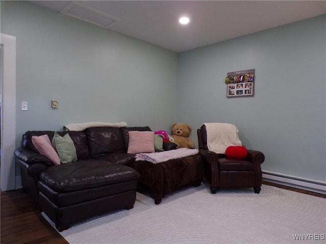 living area with attic access, wood finished floors, and recessed lighting