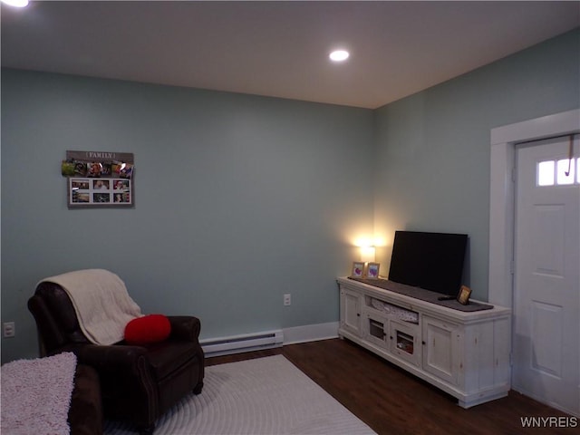 living area featuring baseboards, baseboard heating, dark wood-type flooring, and recessed lighting