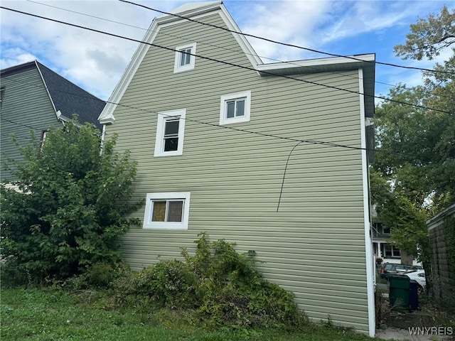 view of property exterior featuring a gambrel roof