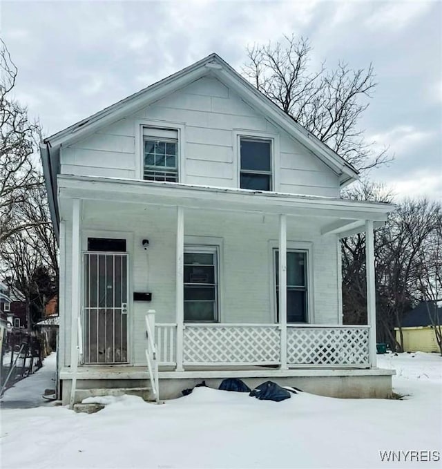 view of front of property featuring covered porch