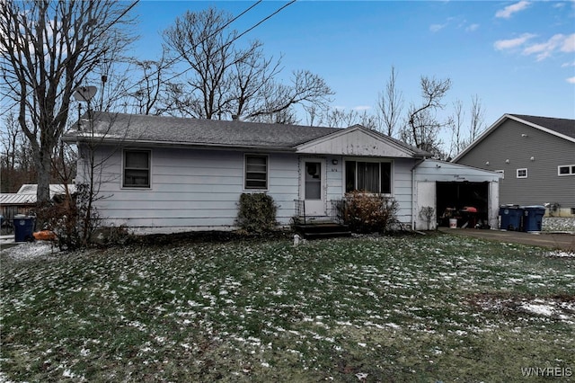 view of front of house with a front lawn and a carport