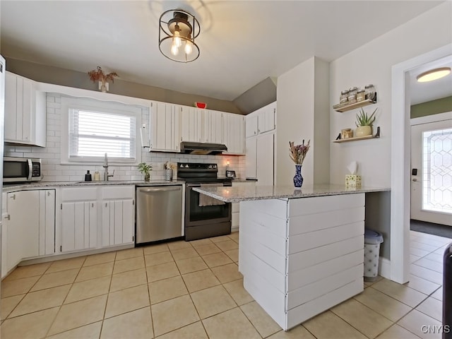 kitchen featuring light tile patterned floors, under cabinet range hood, stainless steel appliances, a sink, and backsplash