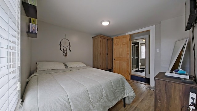 bedroom with wood finished floors