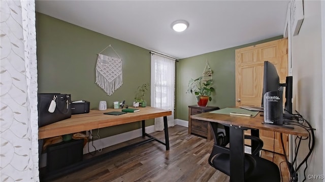 office space with baseboards and dark wood-type flooring